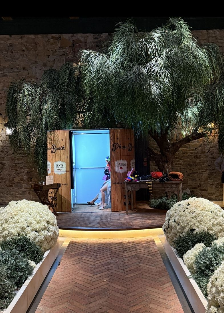 A Booth66 traditional enclosed photo booth set up at a wedding